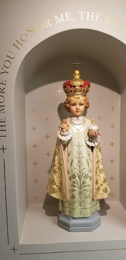 A beautifully crafted statue of a crowned figure, symbolizing divinity and grace.