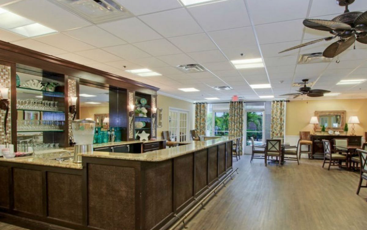 A spacious and modern reception area with a front desk and comfortable seating.