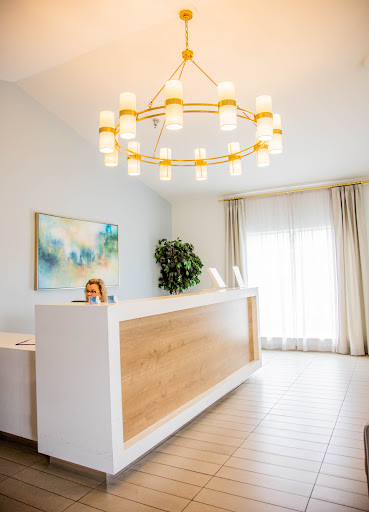 A modern reception area featuring elegant lighting and a welcoming atmosphere.