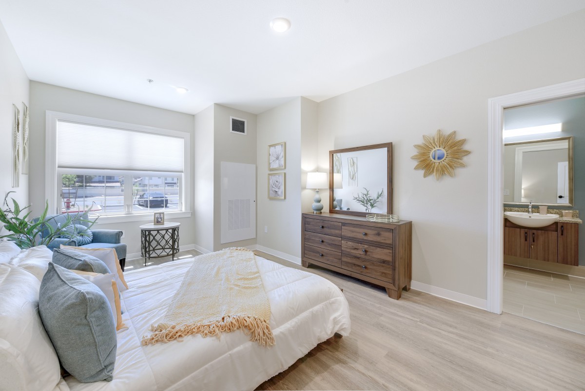 A modern and minimalist bedroom with bright lighting and stylish decor.