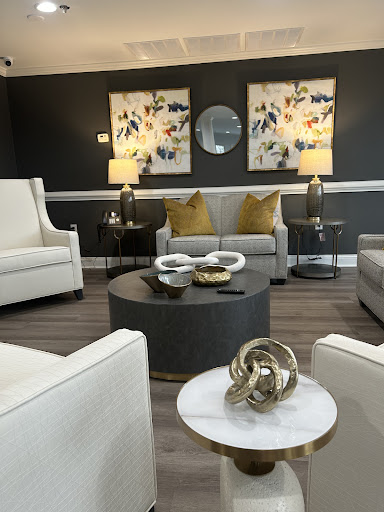 A beautifully designed living room featuring modern furniture, elegant artwork, and a cozy atmosphere.