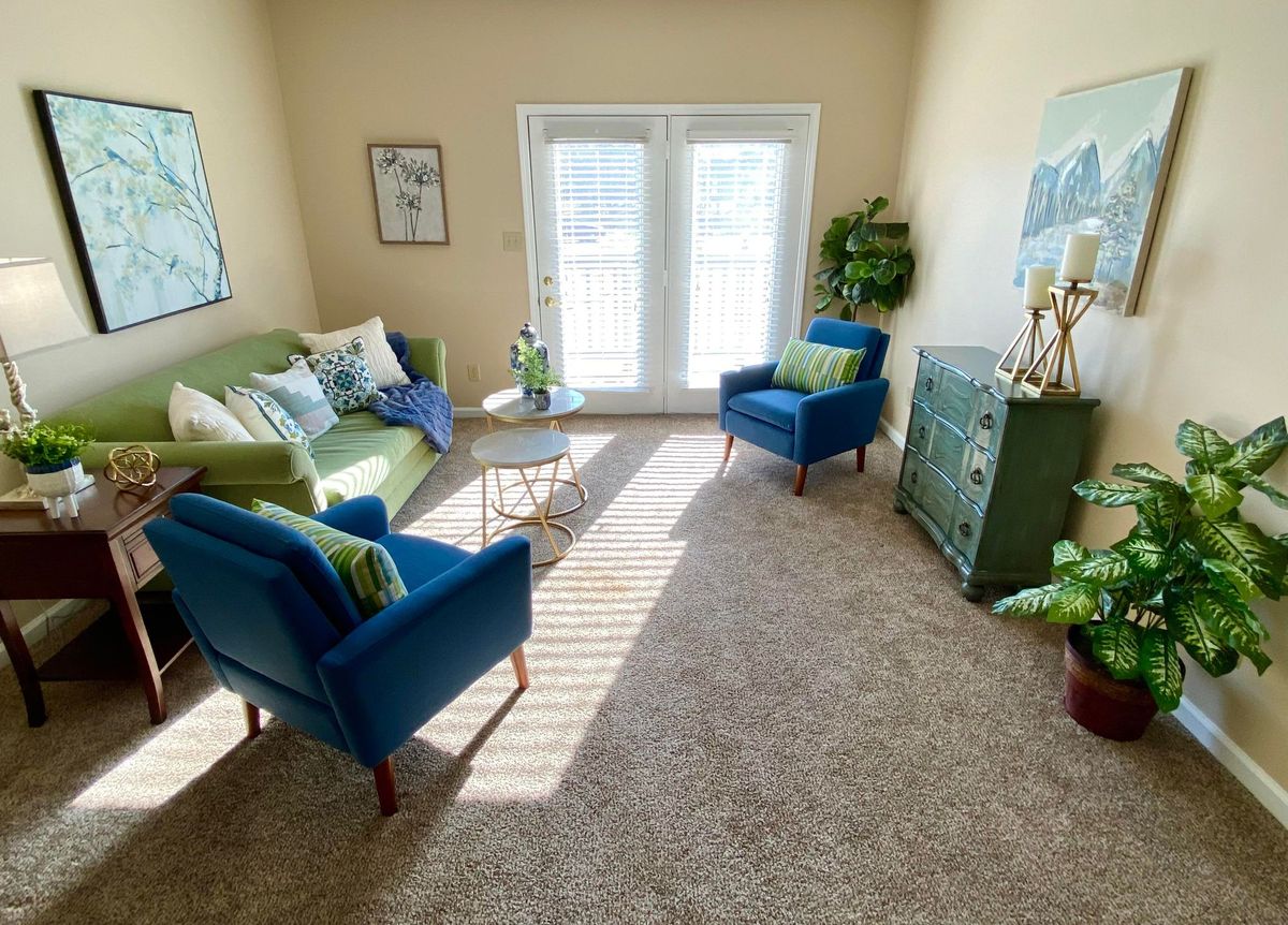 A cozy living room with stylish furniture and natural light.