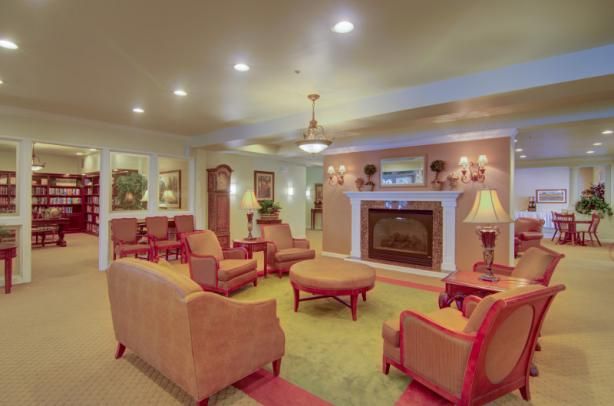 A cozy living room with comfortable seating and a fireplace.