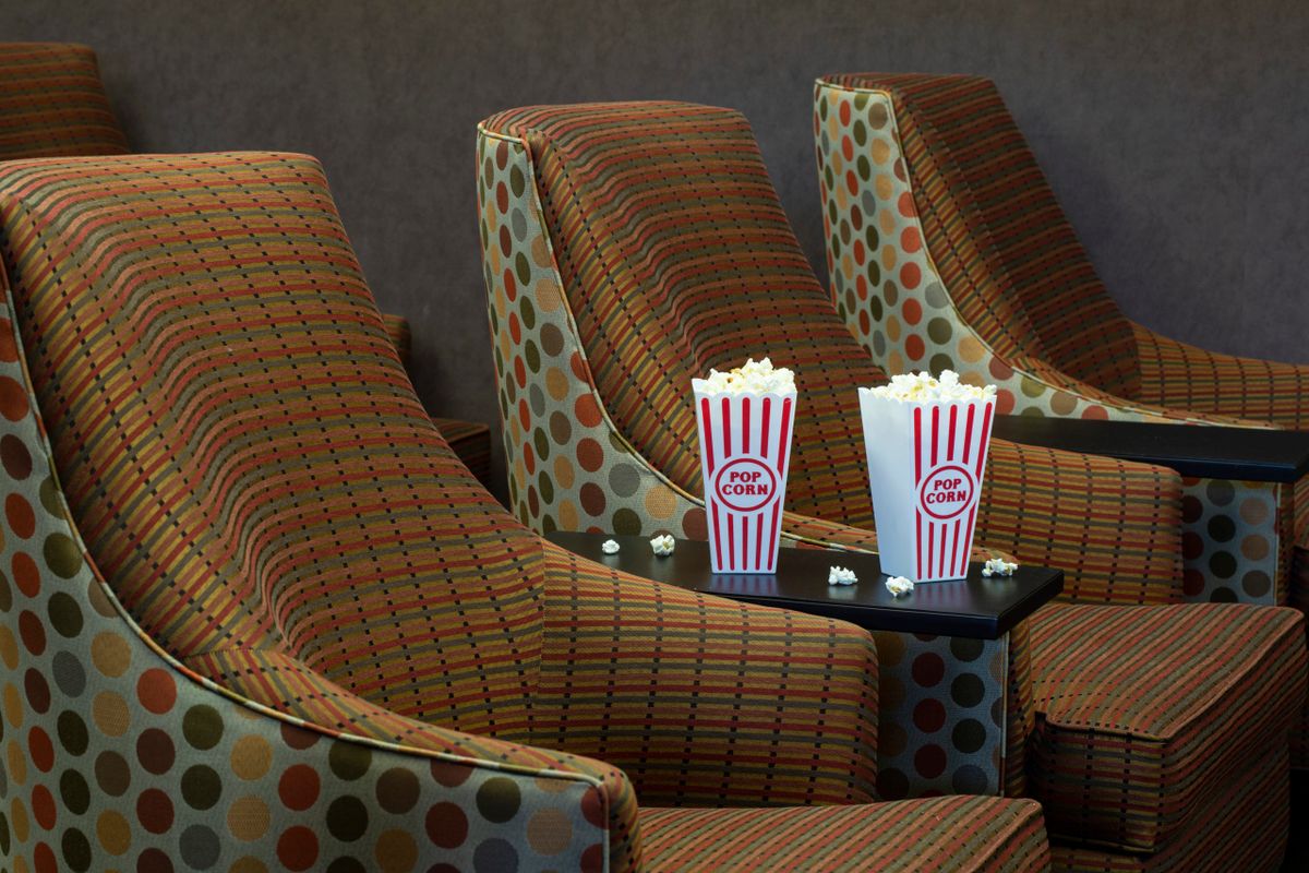 Cozy cinema seating with popcorn ready for a movie night.