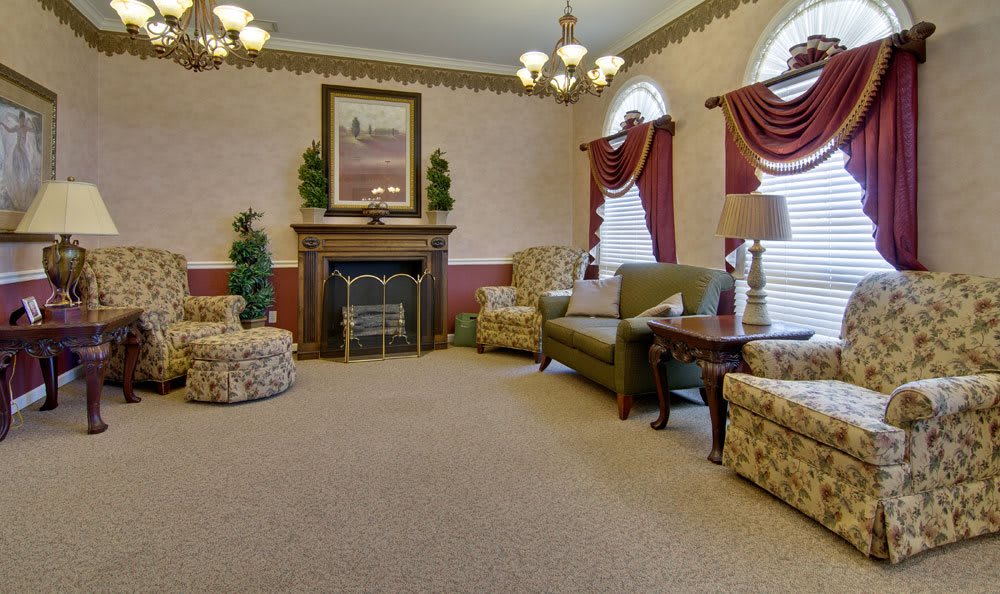 A traditional living room with elegant furnishings and a cozy fireplace.