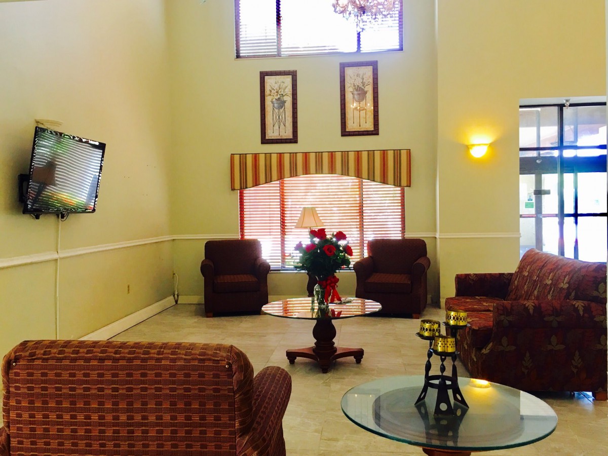 A spacious lobby area with comfortable seating and elegant decor.