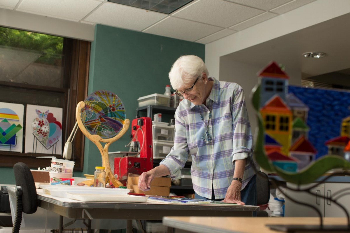 A woman painting in a creative art studio.