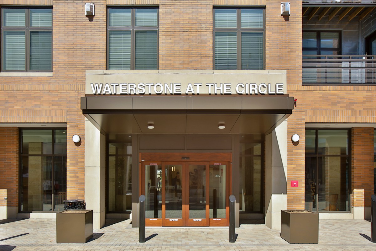 Entrance to Waterstone at the Circle with glass doors and a visible sign.