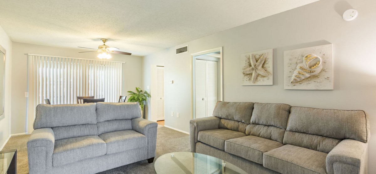 A modern living room with comfortable seating and stylish decor.