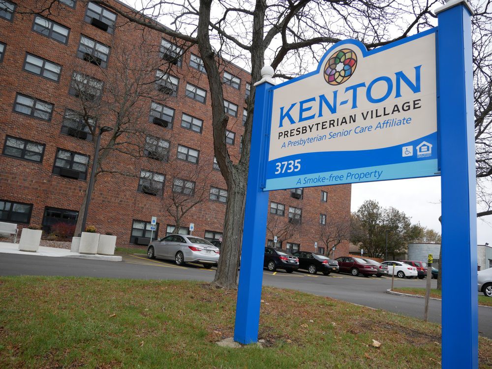 Exterior view of the Ken-Ton Presbyterian Village with its entrance sign and parking area.