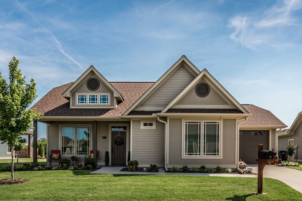 A beautiful suburban home with a well-maintained lawn.