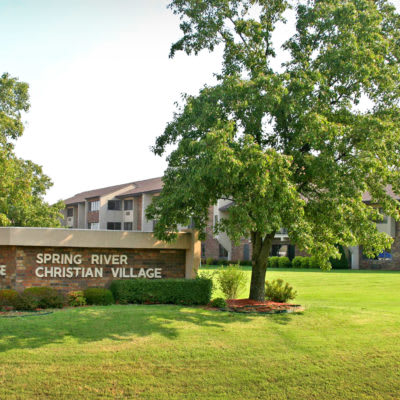 Spring Park Christian Village building with surrounding trees and lawn.