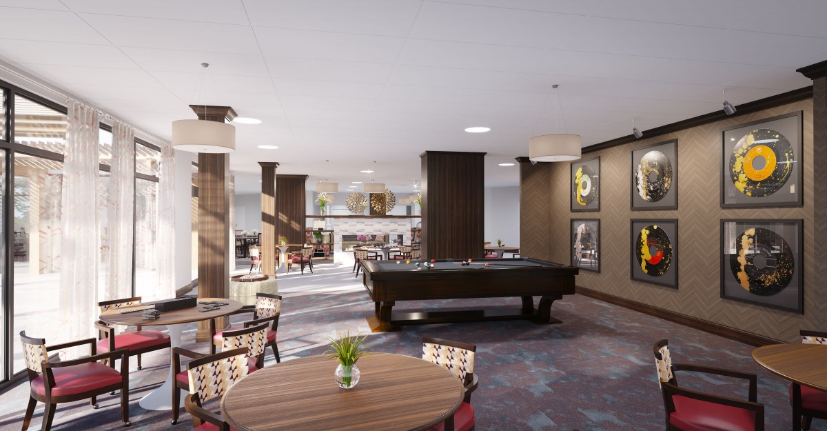 A modern lounge area featuring a pool table and comfortable seating.