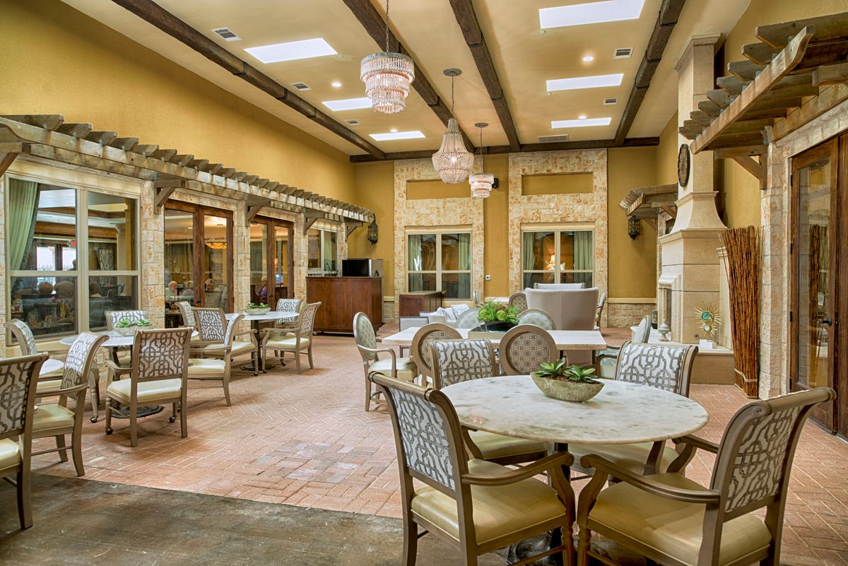 A luxurious and spacious seating area with elegant decor and ample natural light.