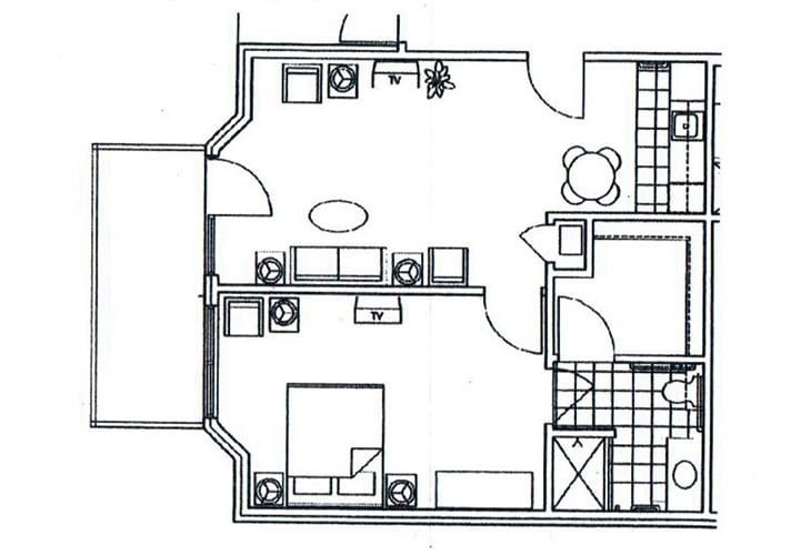 A floor plan illustrating the layout of an apartment with designated living areas and furniture arrangement.