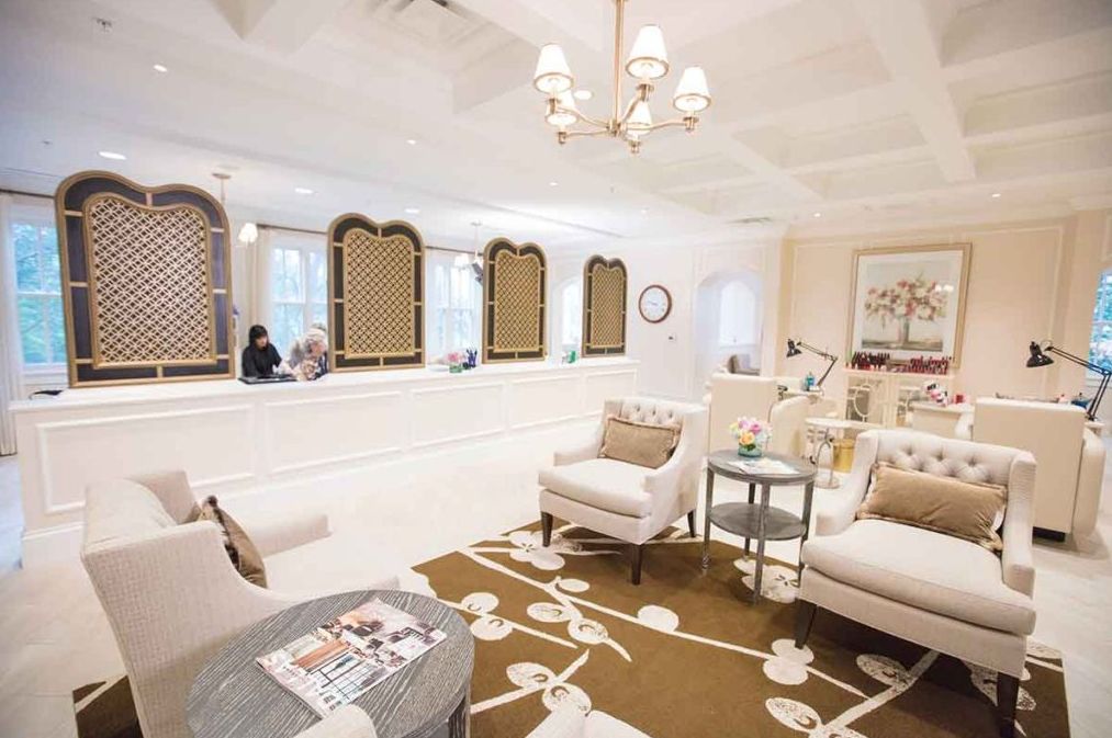 A beautifully designed waiting room with cozy lounge chairs and warm decor.