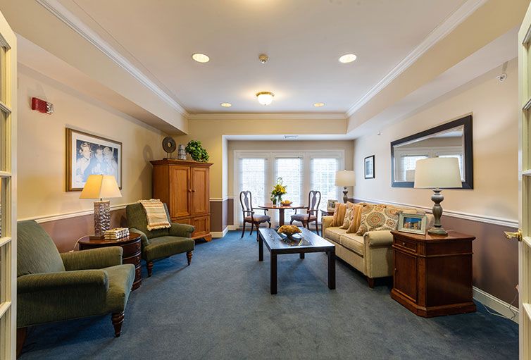 A cozy living room with comfortable seating and elegant decor.