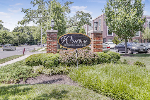 Entrance sign of a residential apartment complex surrounded by well-maintained landscaping.