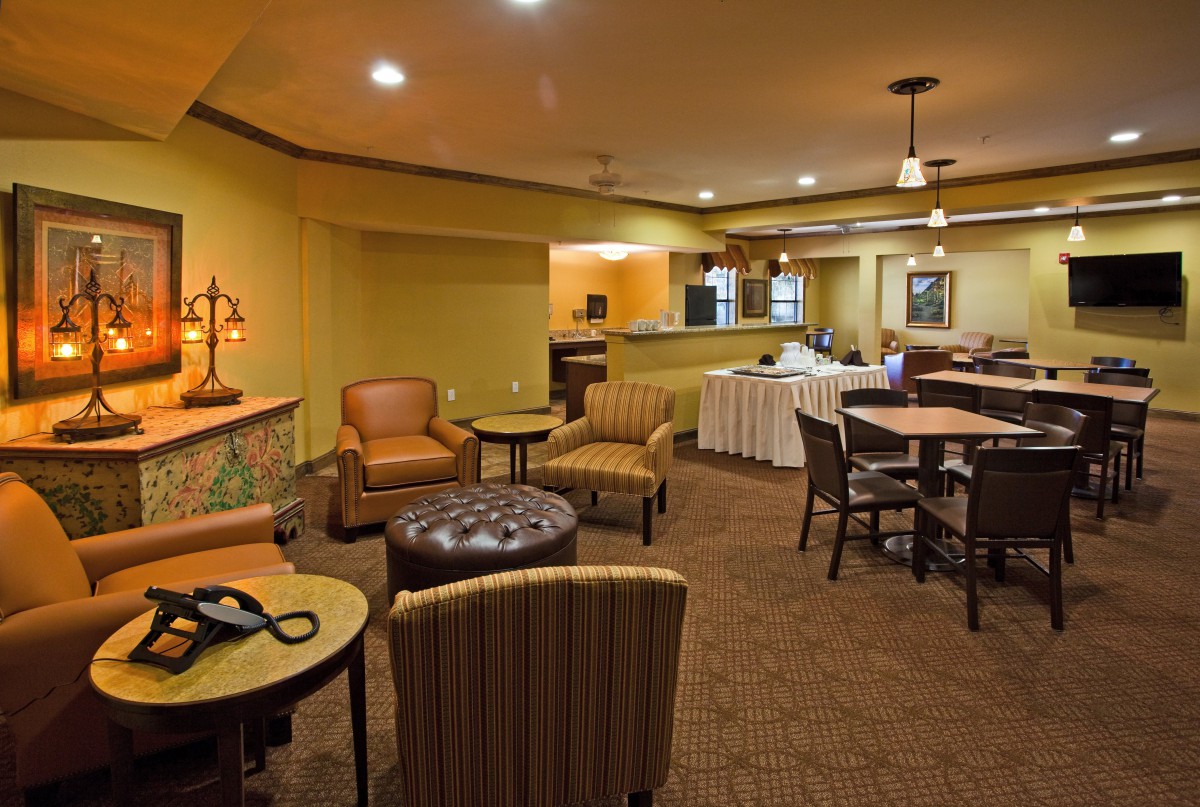 A cozy lounge area with comfortable seating and warm lighting.