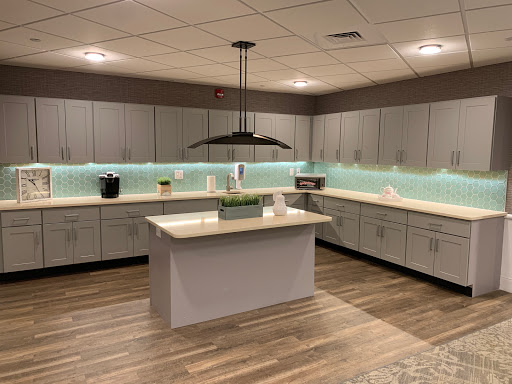 A modern and minimalist kitchen featuring sleek cabinets, a spacious countertop, and stylish lighting.