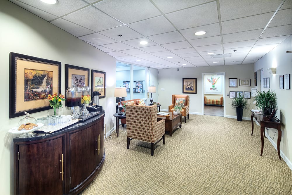 A well-decorated waiting room with comfortable seating and tasteful decor.