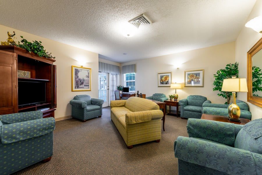 A cozy living room with comfortable seating and soft lighting.