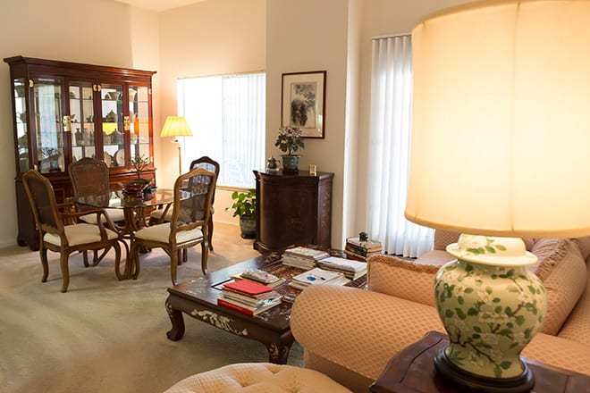 A cozy living room with an elegant dining area and classic furniture.