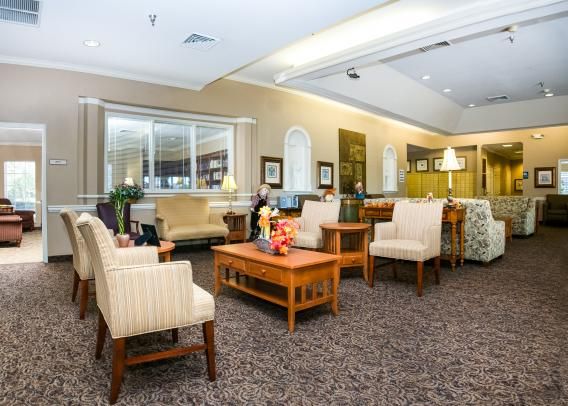A comfortable lobby area with elegant furniture and warm lighting.
