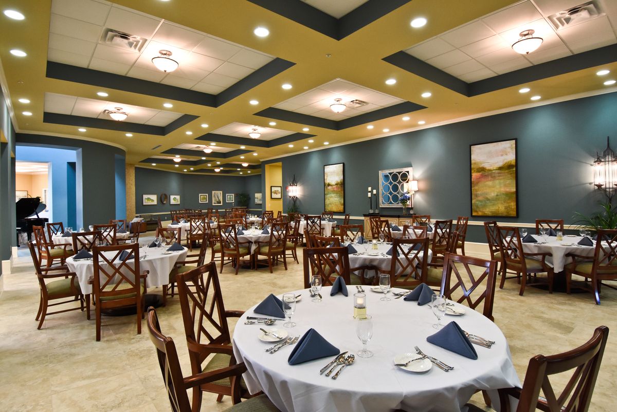 Elegant restaurant dining area with neatly arranged tables and chairs.