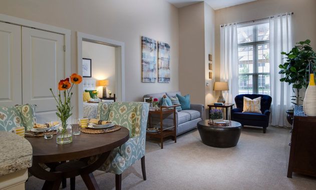 A cozy and modern living room with stylish furniture and bright lighting.