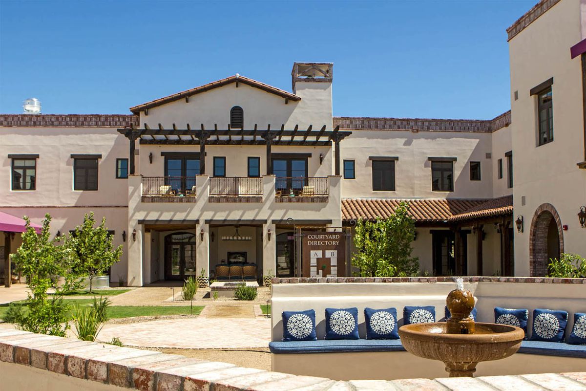 A luxurious residential home with a spacious patio and garden area.