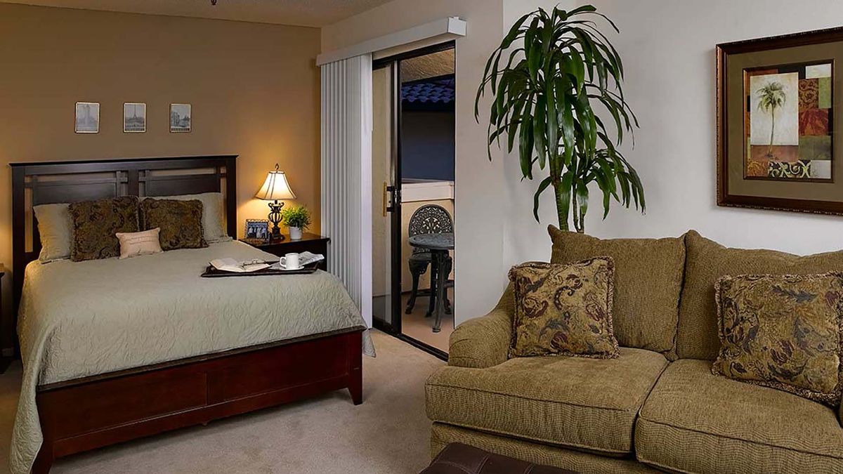 Cozy bedroom with stylish furniture and decor.