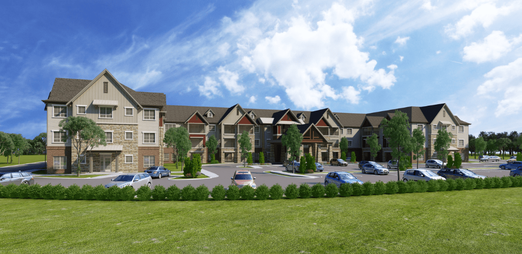 A modern apartment complex with a landscaped parking lot under a partly cloudy sky.
