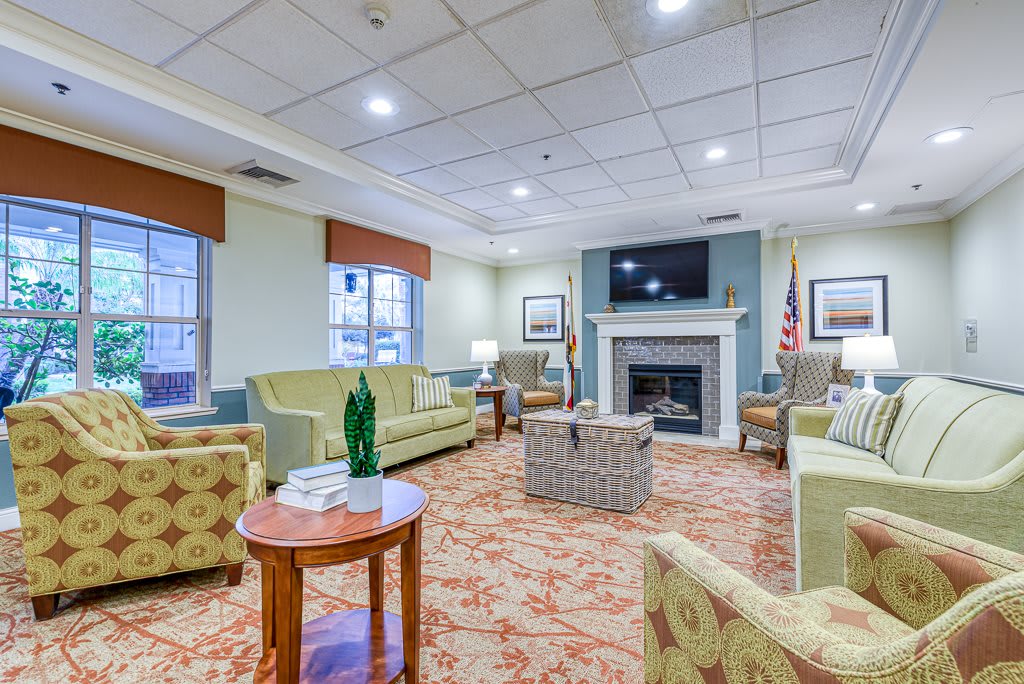 A cozy living room with comfortable seating and a fireplace.