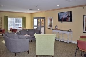 A cozy living room with comfortable seating and a television.