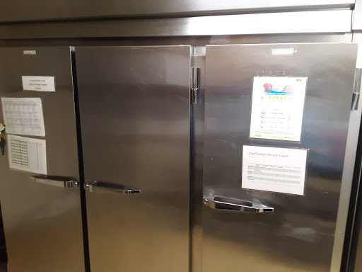 A stainless steel refrigerator with closed doors, typically used in a kitchen or commercial setting.