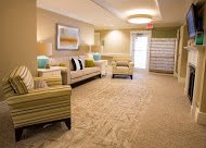 A well-lit lobby area featuring comfortable seating and elegant dcor.