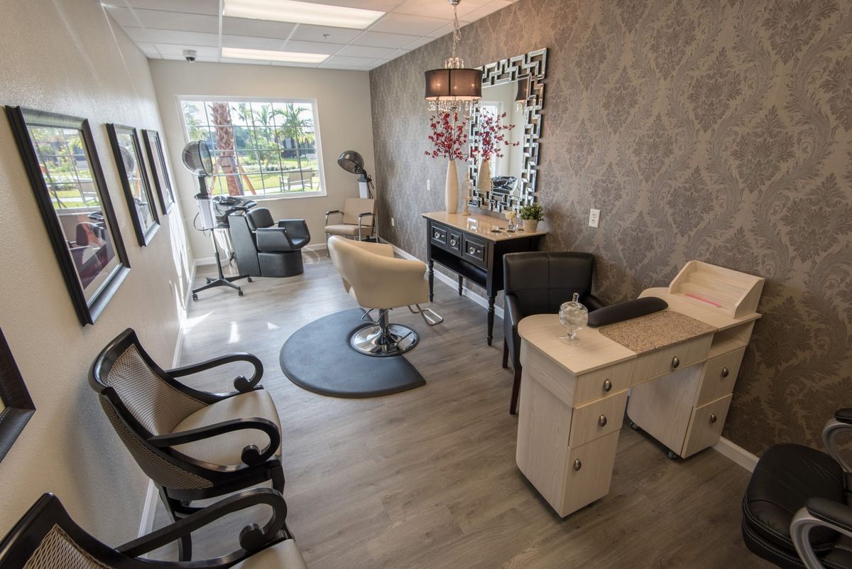 A modern hair salon with stylish decor and multiple workstations.