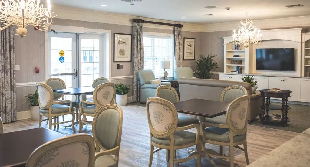 A cozy and elegantly decorated living space with comfortable seating and ample natural light.