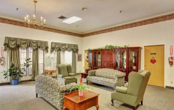 A traditional living room with comfortable seating and elegant decor.