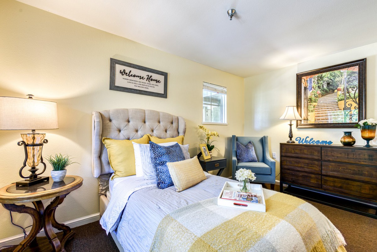 Cozy bedroom with a stylish bed and decorative accents.