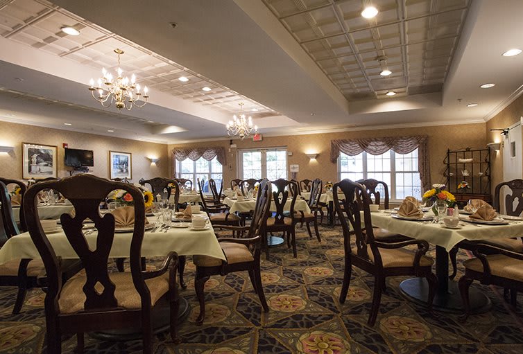 Elegantly decorated restaurant dining area with neatly arranged tables and chairs.
