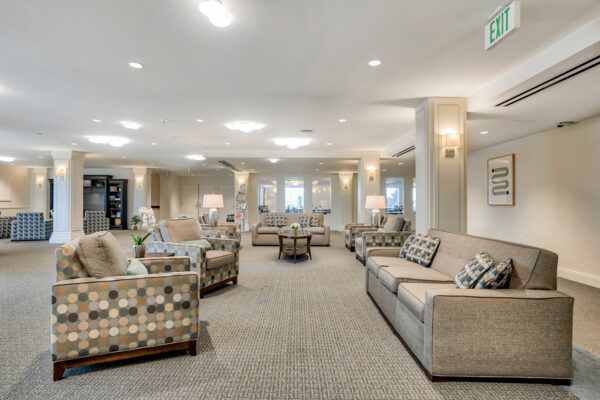 A modern and spacious lobby featuring comfortable sofas and elegant lighting.