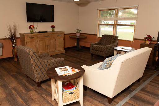 A cozy living room setup featuring comfortable seating and a television.