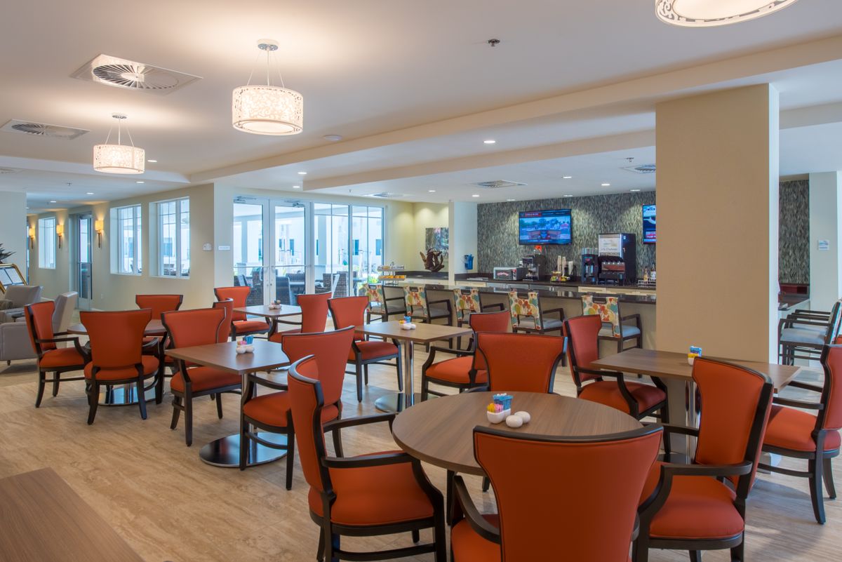 A modern dining area with comfortable seating and contemporary lighting.