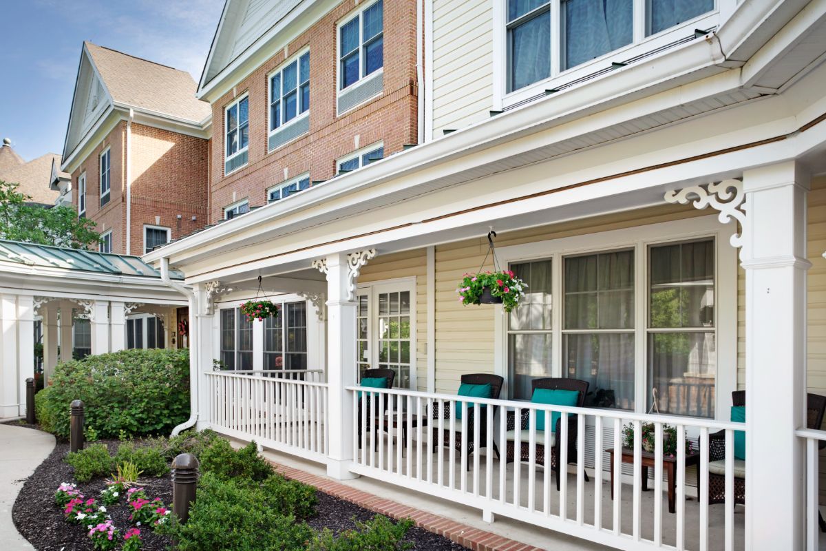 A cozy residential house with a welcoming porch and garden.