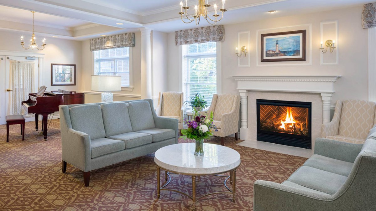 A cozy living room with a fireplace and comfortable seating.