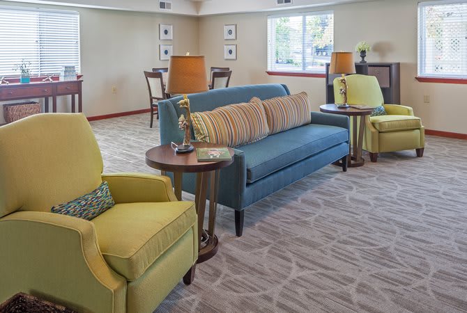 A cozy living room with comfortable seating and warm lighting.