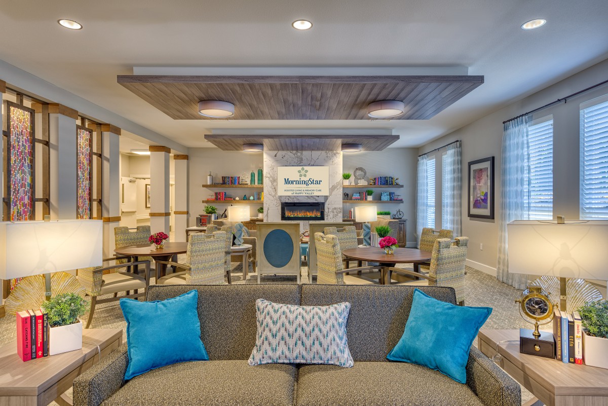 A beautifully designed modern living room with stylish furniture and vibrant accents.