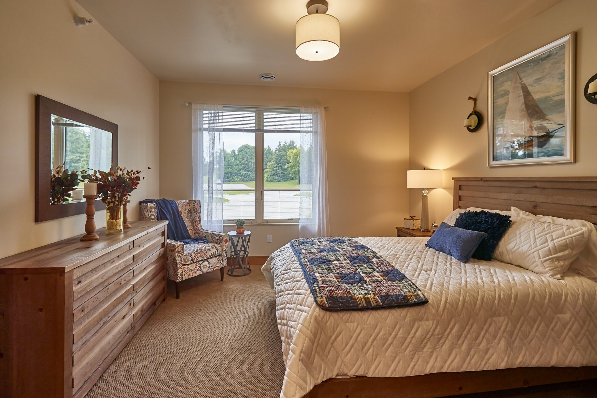 A cozy bedroom with warm lighting and stylish decor.